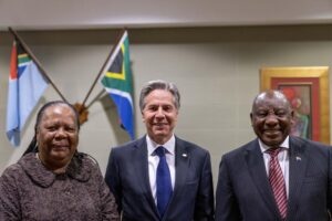 From left; South Africa’s Foreign Minister Naledi Pandor, U.S. Secretary of State Antony Blinken and South Africa’s President Cyril Ramaphosa pose for photographs as they meet at Waterkloof Air Force Base in Centurion, South Africa, Tuesday, Aug. 9, 2022. Blinken is on a ten day trip to Cambodia, Philippines, South Africa, Congo, and Rwanda. (AP Photo/Andrew Harnik, Pool)