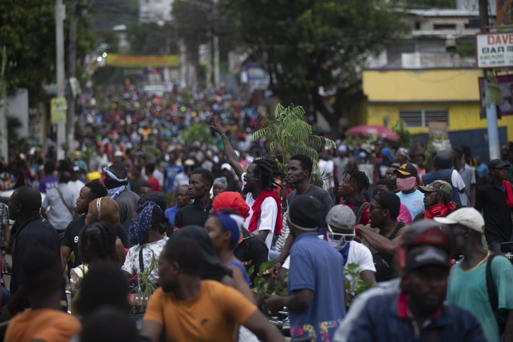 Demonstrators fill the streets during a protest in Port-au-Prince, Haiti, Monday, Aug. 22, 2022. Protesters marched through Haiti’s capital and other major cities, blocking roads and shutting down businesses to demand that Prime Minister Ariel Henry step down and call for a better quality of life. (AP Photo/Odelyn Joseph)