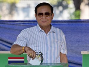 FILE – Thailand’s Prime Minister Prayuth Chan-ocha casts his vote at a polling station in Bangkok, Thailand, Sunday, March 24, 2019, during the nation’s first general election since the military seized power in a 2014 coup. Thailand’s Constitutional Court suspended Prayuth from his duties on Wednesday, Aug. 25, 2022, while it decides whether he violated the country’s term limits, potentially opening a new chapter of turmoil in the nation’s troubled politics. (AP Photo/Gemunu Amarasinghe, File)