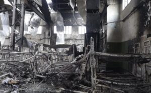 EDS NOTE: GRAPHIC CONTENT – In this photo taken from video a view of destroyed barrack at a prison in Olenivka, in an area controlled by Russian-backed separatist forces, eastern Ukraine, on July 29, 2022. Ukrainian officials say they are struggling to establish the truth surrounding the explosion in a prison that killed dozens of Ukrainian prisoners of war captured by the Russians following the fall of Mariupol. (AP Photo)