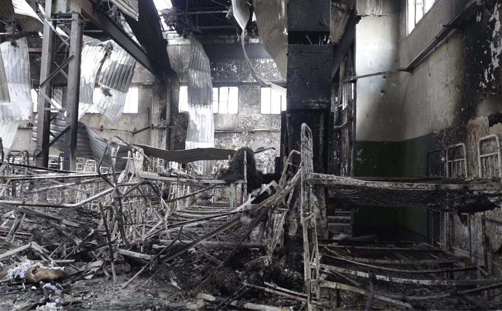 EDS NOTE: GRAPHIC CONTENT – In this photo taken from video a view of destroyed barrack at a prison in Olenivka, in an area controlled by Russian-backed separatist forces, eastern Ukraine, on July 29, 2022. Ukrainian officials say they are struggling to establish the truth surrounding the explosion in a prison that killed dozens of Ukrainian prisoners of war captured by the Russians following the fall of Mariupol. (AP Photo)