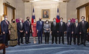 In this photo released by the Taiwan Presidential Office, Taiwan’s President Tsai Ing-wen pose for photos with U.S. Congress members and other Taiwan officials during a meeting at the Presidential Office in Taipei, Taiwan on Monday, Aug. 15, 2022. The delegation of U.S. Congress members visited Taiwan parliament on Monday in a further sign of support among American lawmakers for the self-governing island. (Taiwan Presidential Office via AP)