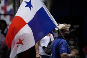 Members of the Teachers Union hold a general assembly as they end their nationwide strike to protest inflation outside the Republica de Venezuela school in Panama City, Monday, Aug. 1, 2022. Teachers continue to negotiate with the government over other issues. (AP Photo/Arnulfo Franco)