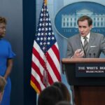 White House press secretary Karine Jean-Pierre listens as National Security Council spokesman John Kirby speaks during a briefing at the White House, Monday, Aug. 1, 2022, in Washington. (AP Photo/Evan Vucci)