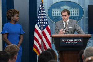 White House press secretary Karine Jean-Pierre listens as National Security Council spokesman John Kirby speaks during a briefing at the White House, Monday, Aug. 1, 2022, in Washington. (AP Photo/Evan Vucci)