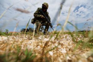 A member of the Japan Ground Self-Defense Force (JGSDF) conducts a military drill next to an anti-ship missiles unit, at JGSDF Miyako camp on Miyako Island, Okinawa prefecture, Japan April 21, 2022. Picture taken April 21, 2022. REUTERS/Issei Kato/File Photo