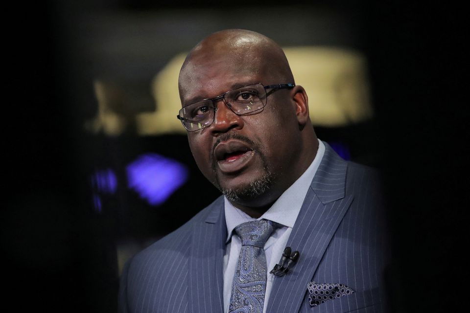 Former basketball star Shaquille O’Neal, speaks during an interview on CNBC about joining the board of Papa John’s International Inc., on the floor of the New York Stock Exchange (NYSE) in New York, U.S., March 22, 2019. REUTERS/Brendan McDermid/File Photo