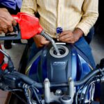 People refuel their motorcycles at a gasoline station after fuel price surge up to fifty percent in Dhaka, Bangladesh, August 6, 2022. REUTERS/Mohammad Ponir Hossain