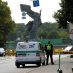 A municipal police officer looks on during dismantling of a Soviet World War Two victory monument in Riga, Latvia August 23, 2022. REUTERS/Ints Kalnins