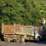 A Serbian flag is seen as trucks block a road in Zupce, Kosovo August 1, 2022. REUTERS/Fatos Bytyci/File Photo