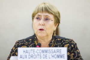 FILE – Michelle Bachelet, High Commissioner for Human Rights, delivers her statement during the opening day of the 50th session of the Human Rights Council, at the European headquarters of the United Nations in Geneva, Switzerland, June 13, 2022. The outgoing U.N. human rights chief has suggested her office won’t make good on her promise to release its long-awaited report on China’s Xinjiang region by the end of her term. (Valentin Flauraud/Keystone via AP, File)