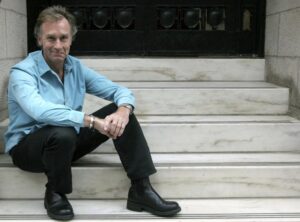 FILE – Author Nicholas Evans poses in New York Sept. 29, 2005. Evans, the British author of the bestselling novel “The Horse Whisperer,” has died at 72. His representatives at United Agents said Evans died “suddenly” on Aug. 9, 2022 following a heart attack. Published in 1995, “The Horse Whisperer” was Evans’ debut novel and sold more than 15 million copies worldwide. The story of a trainer hired to help an injured teenager and her horse back to health was adapted into a Hollywood movie starring Robert Redford as the title character and Scarlett Johansson playing the young rider in her breakout role. (AP Photo/Tina Fineberg, File)