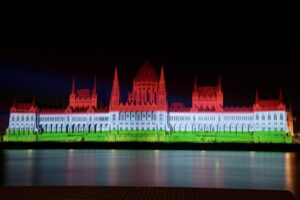 FILE – The colors of the Hungarian flag illuminate the Parliament building to mark the national holiday celebrating Hungary’s statehood in Budapest, Hungary, Saturday, Aug. 20, 2022. State founder St. Stephen I, the first king of Hungary was crowned in 1000 A.D. The two top officials of Hungary’s meteorological service have been fired after an inaccurate rain forecast prompted the postponement of a fireworks display on the country’s most important national holiday. (Peter Lakatos/MTI via AP, File)