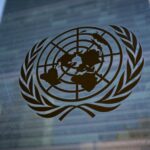 FILE – The symbol of the United Nations is displayed outside the Secretariat Building during an emergency meeting of the UN General Assembly, Monday, Feb. 28, 2022, at the United Nations Headquarters, in New York. As 191 countries approach the end to a four-week conference to review the landmark U.N. treaty aimed at curbing the spread of nuclear weapons, Russia’s invasion of Ukraine and takeover of Europe’s largest nuclear power plant and rivalries between the West and China were posing key obstacles to agreement on a final document. (AP Photo/John Minchillo, File)