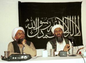 FILE – In this 1998 file photo made available Friday, March 19, 2004, Ayman al-Zawahri, left, listens during a news conference with Osama bin Laden in Khost, Afghanistan. A U.S. airstrike has killed al-Qaida leader Ayman al-Zawahri in Afghanistan, according to a person familiar with the matter. President Joe Biden will speak about the operation on Monday night, Aug. 1, 2022, from the White House. (AP Photo/Mazhar Ali Khan, File)