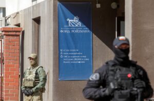 Russian law enforcement officers stand guard outside the office of Roizman Charity Fund, after its founder and politician Yevgeny Roizman was reportedly detained in Yekaterinburg, Russia August 24, 2022. REUTERS/Stringer