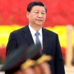 Chinese President Xi Jinping arrives for a ceremony at the Monument to the People’s Heroes on Tiananmen Square to mark Martyrs’ Day in Beijing