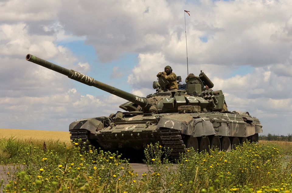 A tank of Russian troops drives in Russian-held part of Zaporizhzhia region, Ukraine, July 23, 2022. REUTERS/Alexander Ermochenko/File Photo