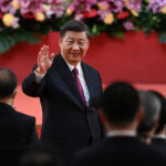 FILE PHOTO: China’s President Xi Jinping waves following his speech after a ceremony to inaugurate the city’s new leader and government in Hong Kong