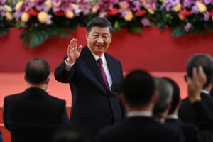 FILE PHOTO: China’s President Xi Jinping waves following his speech after a ceremony to inaugurate the city’s new leader and government in Hong Kong