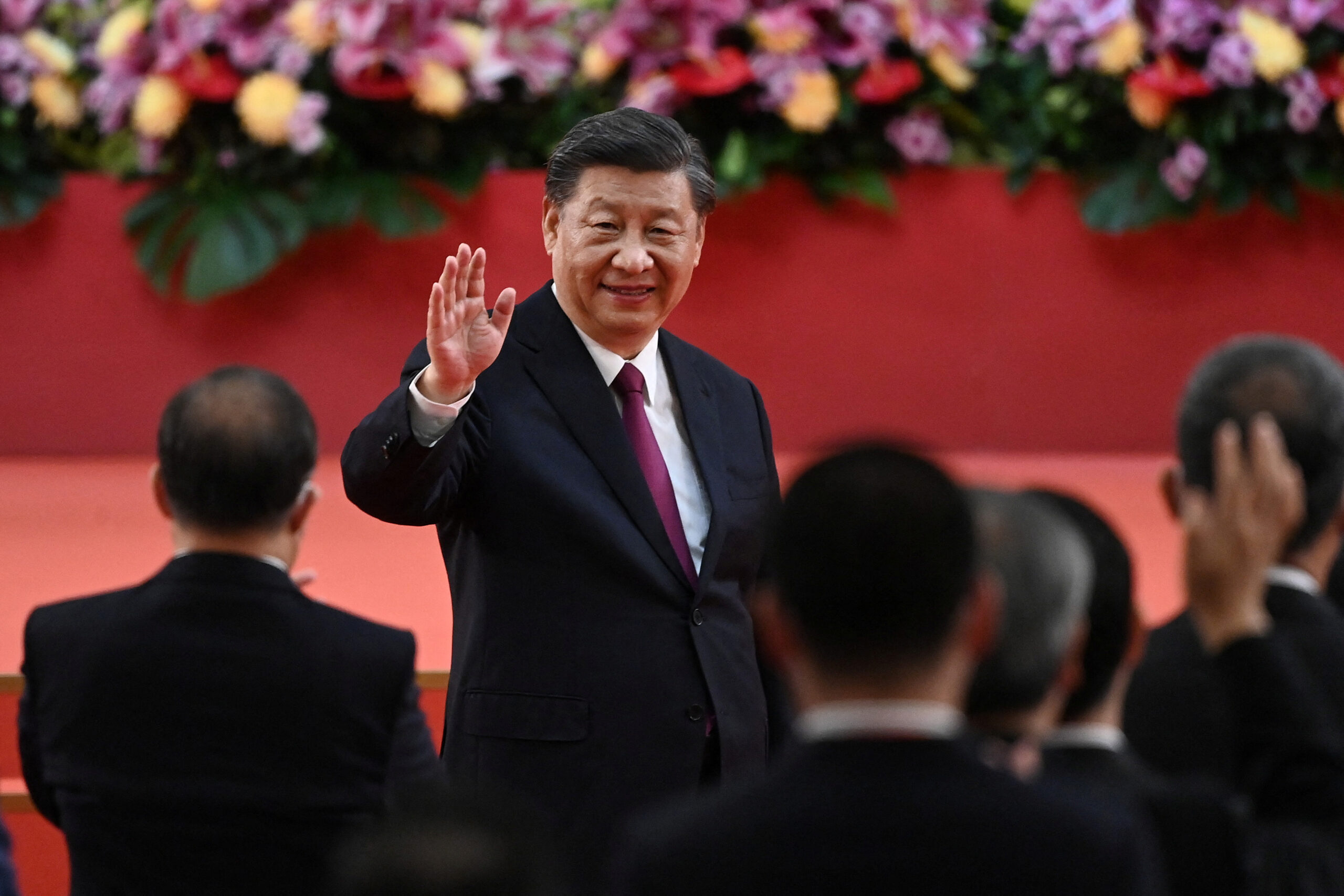 FILE PHOTO: China’s President Xi Jinping waves following his speech after a ceremony to inaugurate the city’s new leader and government in Hong Kong