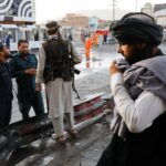 Taliban fighters stand guard at the site of a blast in Kabul, Afghanistan, August 6, 2022. REUTERS/Ali Khara