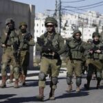 Gaza ceasefire talks between Israel, militants hold, crossings reopen