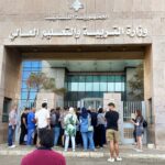 People gather at an entrance of the Ministry of Education and Higher Education during intermittent workers strike in Beirut, Lebanon August 17, 2022. REUTERS/Mohamed Azakir