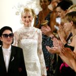 Models applaud Japanese designer Hanae Mori (L) at the end of her Haute Couture 2003-2004 Autumn-Winter collection in Paris, July 9, 2003.