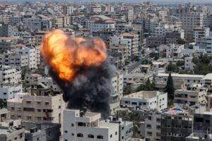 flame and smoke rise during an Israeli air strike, amid Israel-Gaza fighting, in Gaza City August 6, 2022. REUTERS/Mohammed Salem