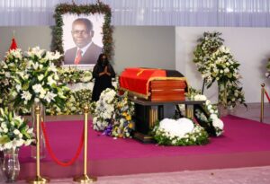 A woman pays her respect during a memorial service of Angola’s former President Jose Eduardo dos Santos. REUTERS/Siphiwe Sibeko