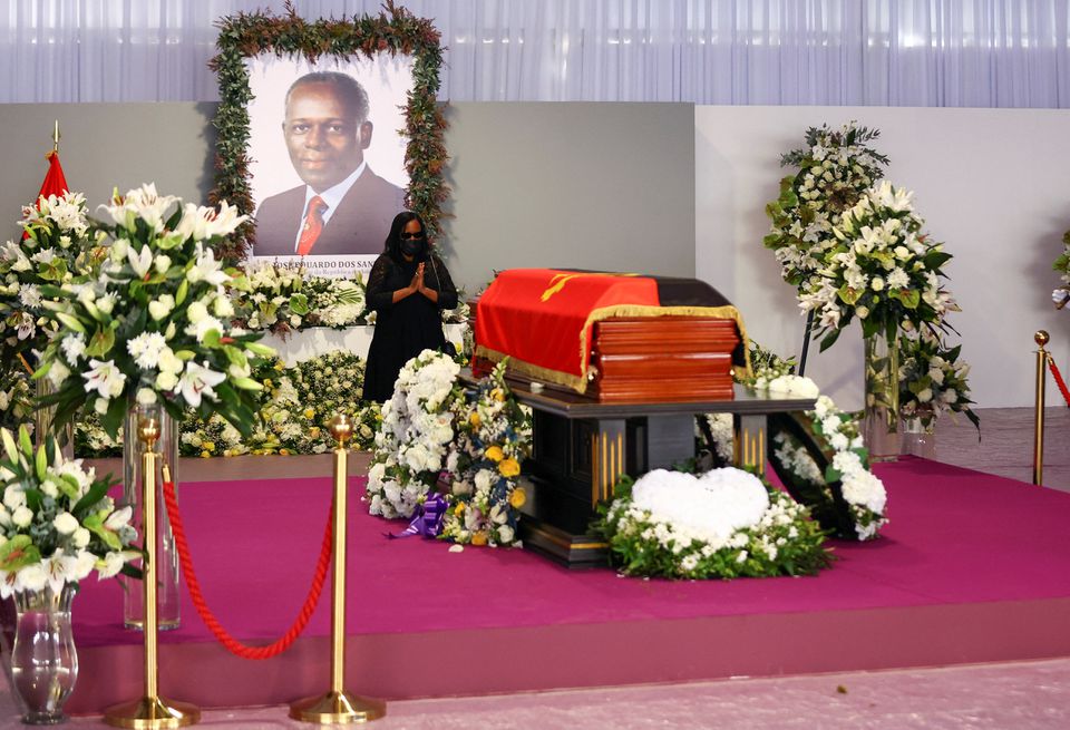 A woman pays her respect during a memorial service of Angola’s former President Jose Eduardo dos Santos. REUTERS/Siphiwe Sibeko