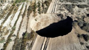 A sinkhole is exposed at a mining zone close to Tierra Amarilla town, in Copiapo, Chile, August 1, 2022. REUTERS/Johan Godoy