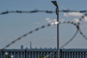 Zaporizhzhia Nuclear Power Plant is seen from an embankment of the Dnipro river in the town of Nikopol, as Russia’s attack on Ukraine continues, in Dnipropetrovsk region, Ukraine July 20, 2022. REUTERS/Dmytro Smolienko