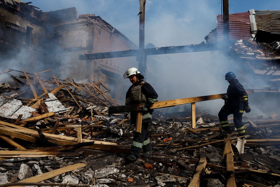 Ukrainian firefighters remove rubbles in a factory destroyed by a Russian strike in the city of Slovyansk, in war-affected area in eastern Ukraine, as Russia’s attack in Ukraine continues, in Donetsk region, Ukraine, August 27,2022. REUTERS/Ammar Awad