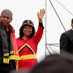 Angola’s president and leader of the ruling MPLA Joao Lourenco and his wife Ana Dias Lourenco wave as they arrive to attend their party’s final rally in Camama, on the outskirts of the capital Luanda, in Angola, August 20, 2022. REUTERS/Lee Bogata