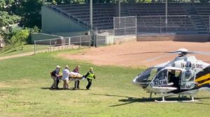 Author Salman Rushdie is transported to a helicopter after he was stabbed on stage before his scheduled speech at the Chautauqua Institution, Chautauqua, New York, U.S., August 12, 2022, in this screengrab taken from a social media video. TWITTER @HoratioGates3 /via REUTERS THIS IMAGE HAS BEEN SUPPLIED BY A THIRD PARTY. MANDATORY CREDIT