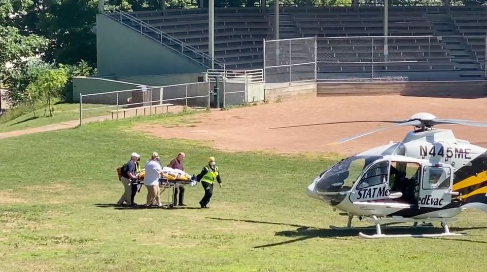 Author Salman Rushdie is transported to a helicopter after he was stabbed on stage before his scheduled speech at the Chautauqua Institution, Chautauqua, New York, U.S., August 12, 2022, in this screengrab taken from a social media video. TWITTER @HoratioGates3 /via REUTERS THIS IMAGE HAS BEEN SUPPLIED BY A THIRD PARTY. MANDATORY CREDIT