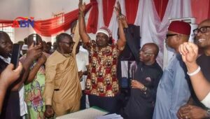 Abia LP candidate for governor Alex Otti (L) and running mate Ikechukwu Emetu (C)