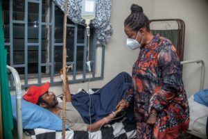 Mrs Obaseki with the physically challenged person in Benin City