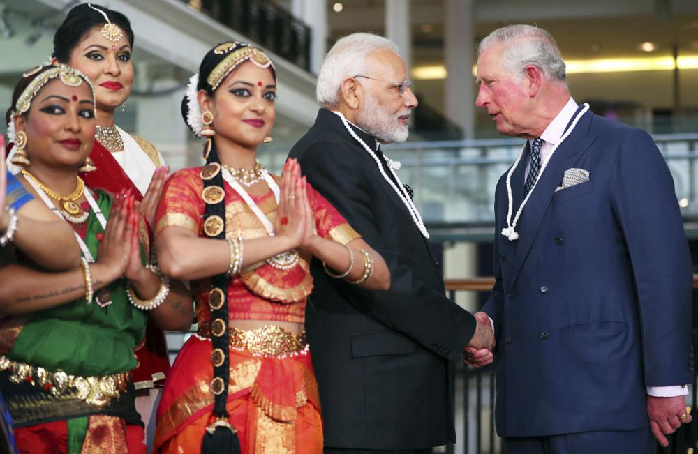 FILE – Britain’s Prince Charles, right, and India’s Prime Minister Narendra Modi visit the Science Museum in London, April 18, 2018. India, once the largest of Britain’s colonies that endured two centuries of imperial rule has moved on. Queen Elizabeth II’s death provoked sympathies from some while for a few others, it jogged memories of a bloody history under the British crown. Among most regular Indians, the news was met with an indifferent shrug. (Hannah McKay/Pool Photo via AP, File)