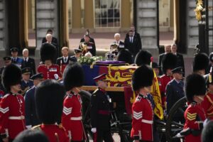 The coffin of Queen Elizabeth II leaves Buckingham Palace for Westminster Hall in London, Wednesday, Sept. 14, 2022. The Queen will lie in state in Westminster Hall for four full days before her funeral on Monday Sept. 19. (AP Photo/Christophe Ena, Pool)