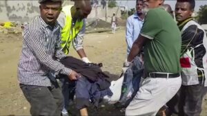 In this image made from video, medics carry the body of a dead or injured victim of an airstrike in Mekele, capital of the Tigray region of northern Ethiopia Wednesday, Sept. 14, 2022. Two airstrikes hit the capital of Ethiopia’s Tigray region Wednesday morning, the director of the city’s flagship Ayder Referral Hospital said. (AP Photo)