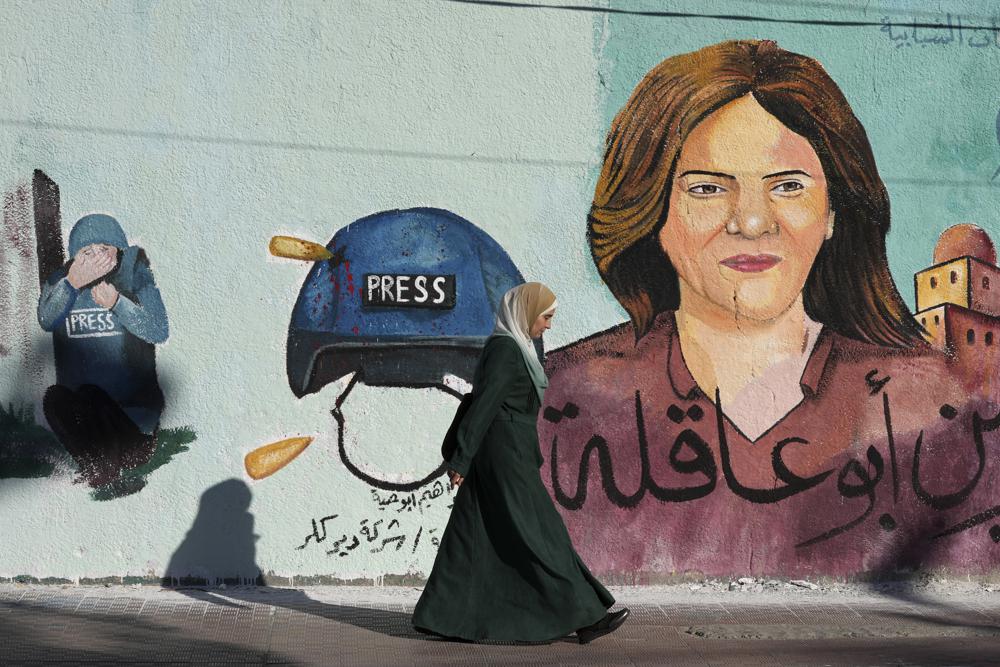 FILE – A mural of slain of Al Jazeera journalist Shireen Abu Akleh who was shot dead during an Israeli military raid in the West Bank town of Jenin, adorns a wall in Gaza City, May 15, 2022.The Israeli military acknowledged for the first time on Monday, Sept. 5, 2022, that one of its soldiers likely killed veteran Al Jazeera journalist Shireen Abu Akleh in May, saying its own investigation shows she was shot by mistake and that no one will face punishment. (AP Photo/Adel Hana, File)