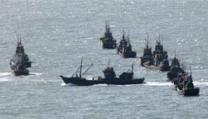 FILE – Chinese fishing boats gather near the South Korea’s western Yeonpyong Island, near the disputed sea border with communist North Korea on May 30, 2009. A Chinese scientific ship bristling with surveillance equipment docked in a Sri Lankan port. Hundreds of fishing boats anchored for months at a time among disputed islands in the South China Sea. And ocean-going ferries, built to be capable of carrying heavy vehicles and large loads of people. (AP Photo/Ahn Young-joon, File)