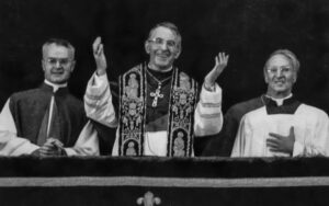 FILE – Pope John Paul I, flanked by Masters of the pontifical ceremonies, Monsignor Virgilio Noe’, right, and Monsignor Orazio Cocchetti, left, smiles as he appears at the lodge window of St. Peter’s Basilica soon after his election Saturday, Aug. 26, 1978. On Sunday, Sept. 4, 2022, Pope Francis will beatify John Paul I, the last formal step before on the path to possible sainthood. (AP Photo)