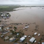 Homes are flooded on Salinas Beach after the passing of Hurricane Fiona in Salinas, Puerto Rico, Monday, Sept. 19, 2022. (AP Photo/Alejandro Granadillo)