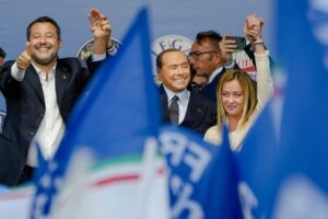 From left, The League’s Matteo Salvini, Forza Italia’s Silvio Berlusconi, and Brothers of Italy’s Giorgia Meloni attend the final rally of the center-right coalition in central Rome, Thursday, Sept. 22, 2022. Italians vote on Sunday for a new Parliament, and they could elect their first far-right premier of the post-war era. If opinion polls hold, Giorgia Meloni could be that premier, as well as become the first woman to lead an Italian government. (AP Photo/Alessandra Tarantino)