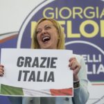 Far-Right party Brothers of Italy’s leader Giorgia Meloni shows a placard reading in Italian “Thank you Italy” at her party’s electoral headquarters in Rome, early Monday, Sept. 26, 2022. Italians voted in a national election that might yield the nation’s first government led by the far right since the end of World War II. (AP Photo/Gregorio Borgia)