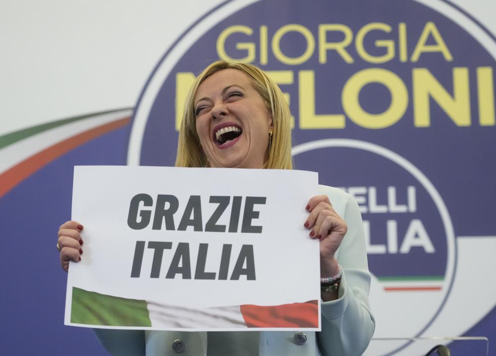 Far-Right party Brothers of Italy’s leader Giorgia Meloni shows a placard reading in Italian “Thank you Italy” at her party’s electoral headquarters in Rome, early Monday, Sept. 26, 2022. Italians voted in a national election that might yield the nation’s first government led by the far right since the end of World War II. (AP Photo/Gregorio Borgia)